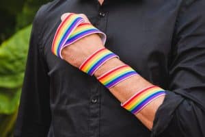 man-with-band-lgbt-colors-hand_23-2148120271